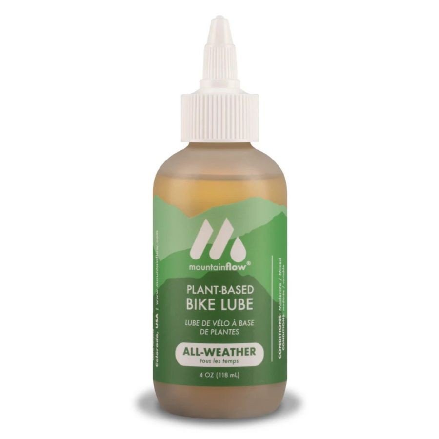 Huile lubrifiante à base de plantes pour chaîne vélo Mountain Flow All-Weather, fonctionnant comme graisseur chaîne vélo, petite bouteille avec bouchon compte-gouttes.